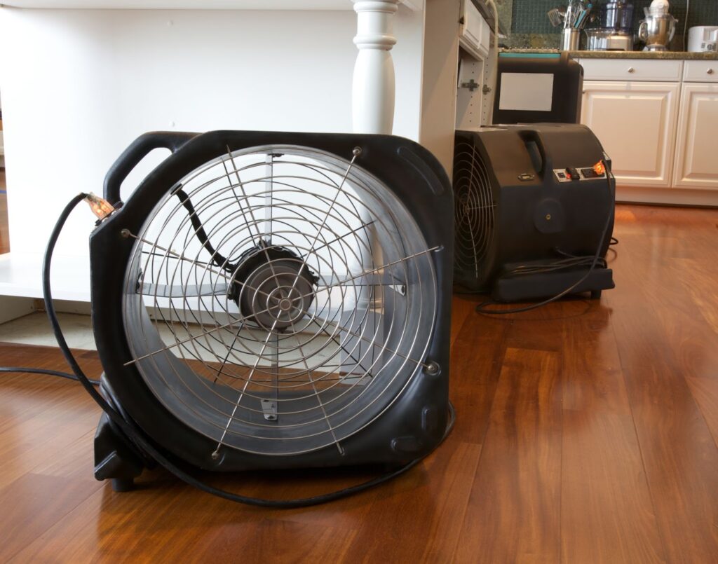 A floor fan used for cleaning up mold, water, and storm damage